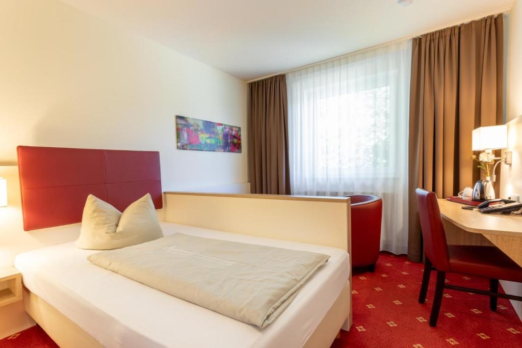 Postel nebo postele na pokoji v ubytování Hotel Montana