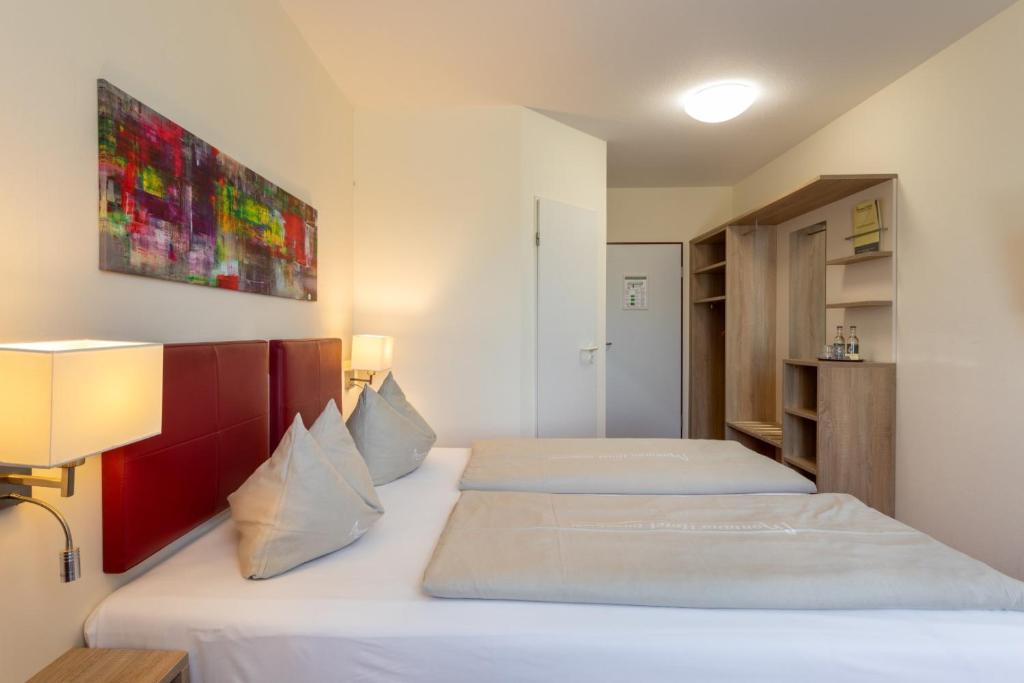 Postel nebo postele na pokoji v ubytování Hotel Montana