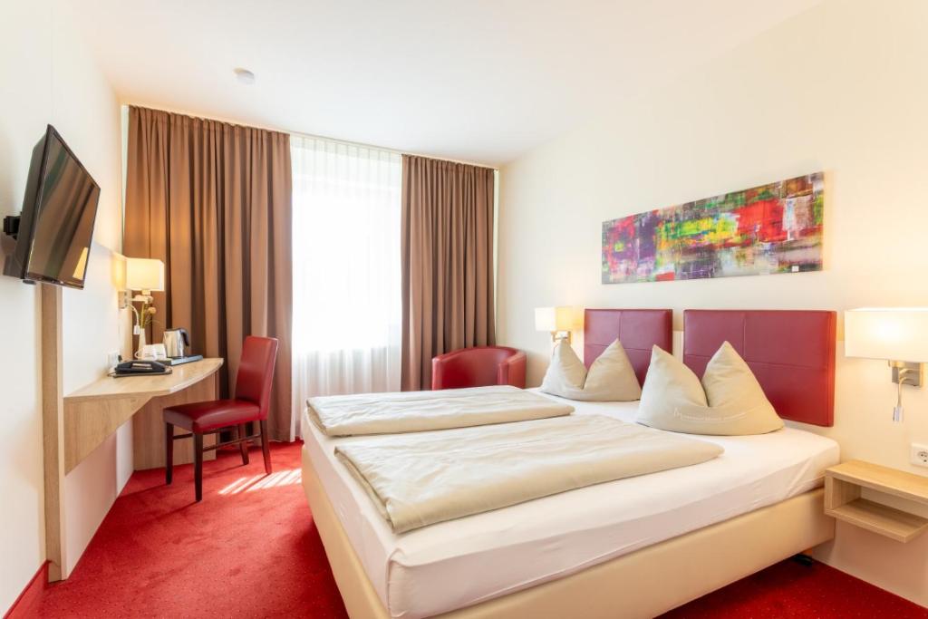 Postel nebo postele na pokoji v ubytování Hotel Montana