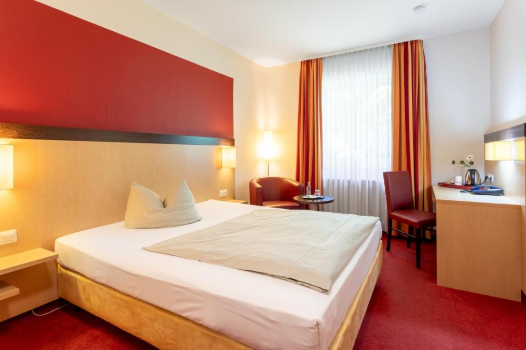 Postel nebo postele na pokoji v ubytování Hotel Montana