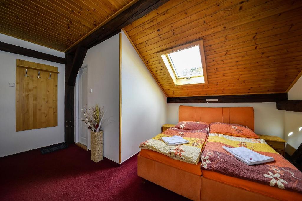 Postel nebo postele na pokoji v ubytování Penzion Kameňák