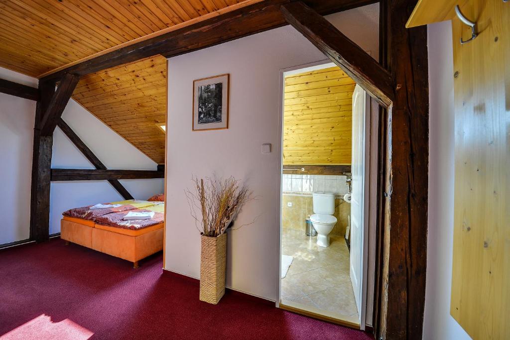 Postel nebo postele na pokoji v ubytování Penzion Kameňák