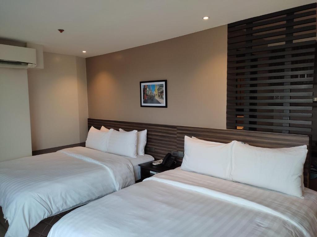 Postel nebo postele na pokoji v ubytování Hotel Inigo