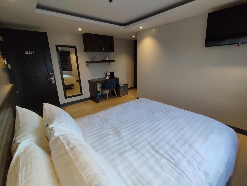 Postel nebo postele na pokoji v ubytování Hotel Inigo