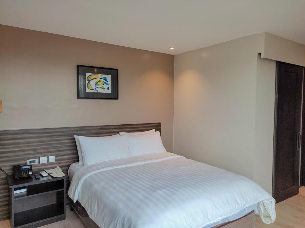 Postel nebo postele na pokoji v ubytování Hotel Inigo