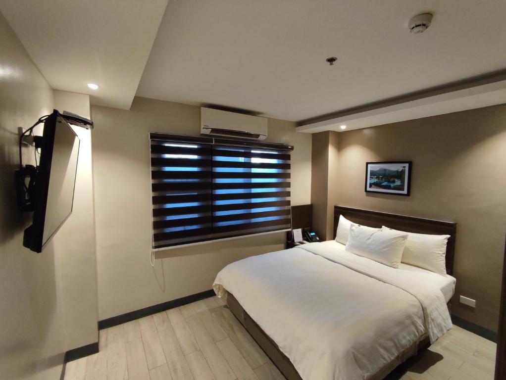 Postel nebo postele na pokoji v ubytování Hotel Inigo