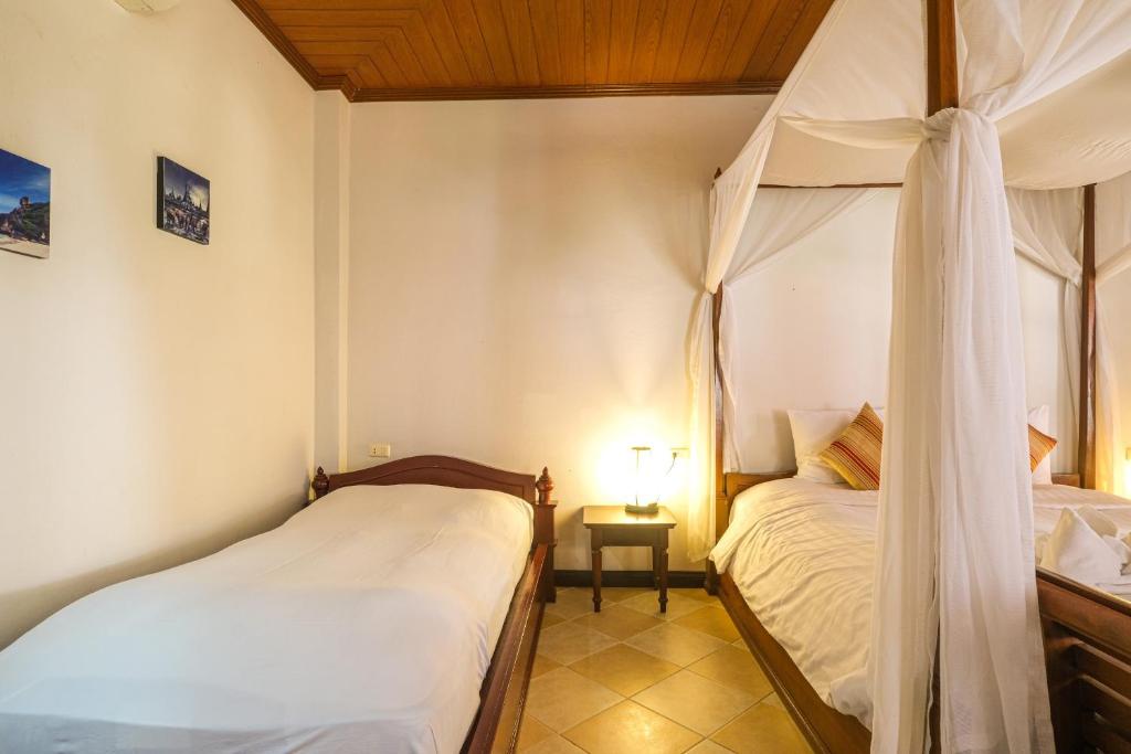 Postel nebo postele na pokoji v ubytování Bhundhari Chaweng Beach Resort Koh Samui - SHA Plus