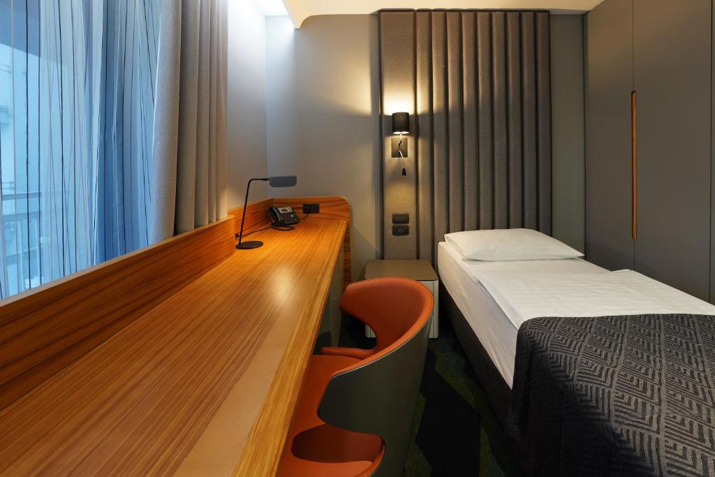 Voodi või voodid majutusasutuse HABAKUK Wellness & Event Hotel toas