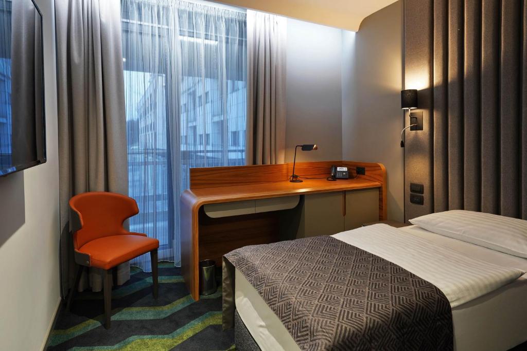 Voodi või voodid majutusasutuse HABAKUK Wellness & Event Hotel toas