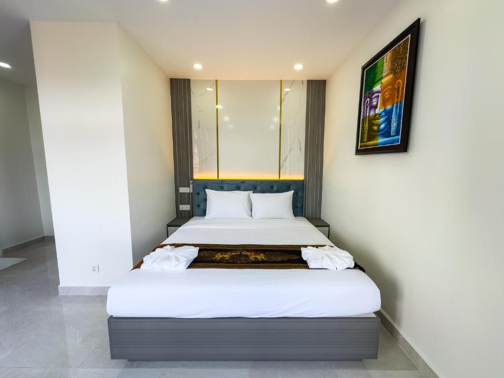 Postel nebo postele na pokoji v ubytování C-Hotel