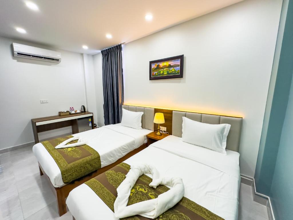 Postel nebo postele na pokoji v ubytování C-Hotel