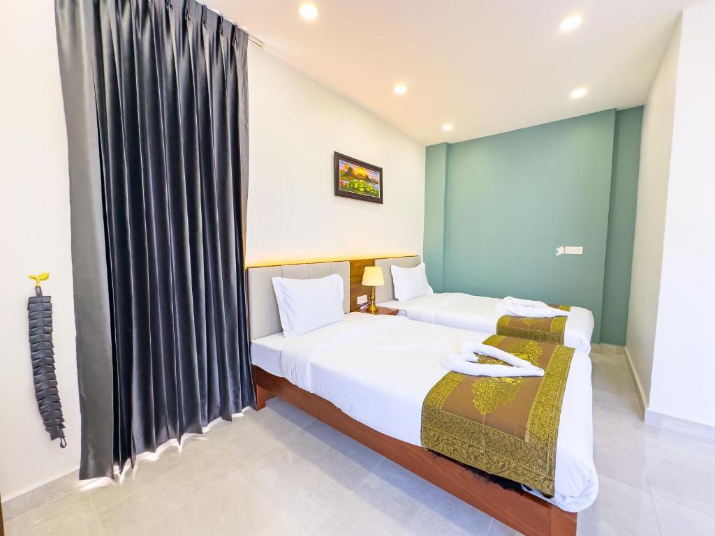 Postel nebo postele na pokoji v ubytování C-Hotel