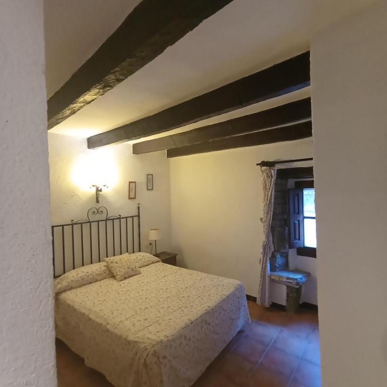 Postel nebo postele na pokoji v ubytování Apartaments Can Lo