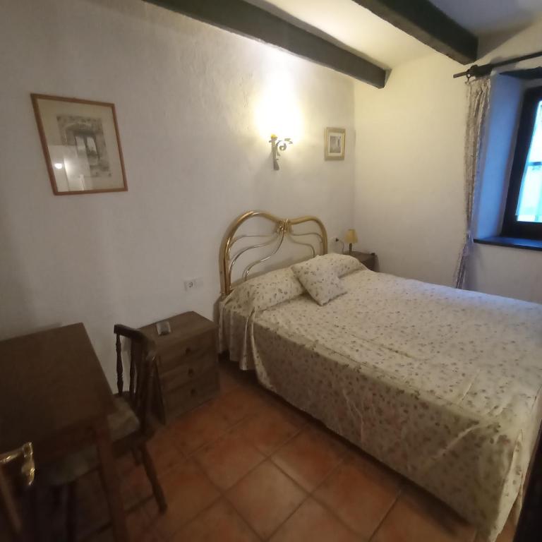 Postel nebo postele na pokoji v ubytování Apartaments Can Lo