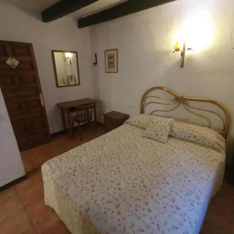 Postel nebo postele na pokoji v ubytování Apartaments Can Lo
