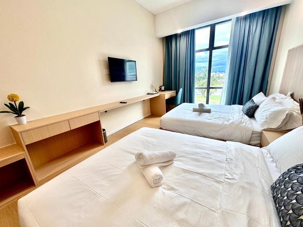 Postel nebo postele na pokoji v ubytování Mizu Homestay at KK Times Square by R2