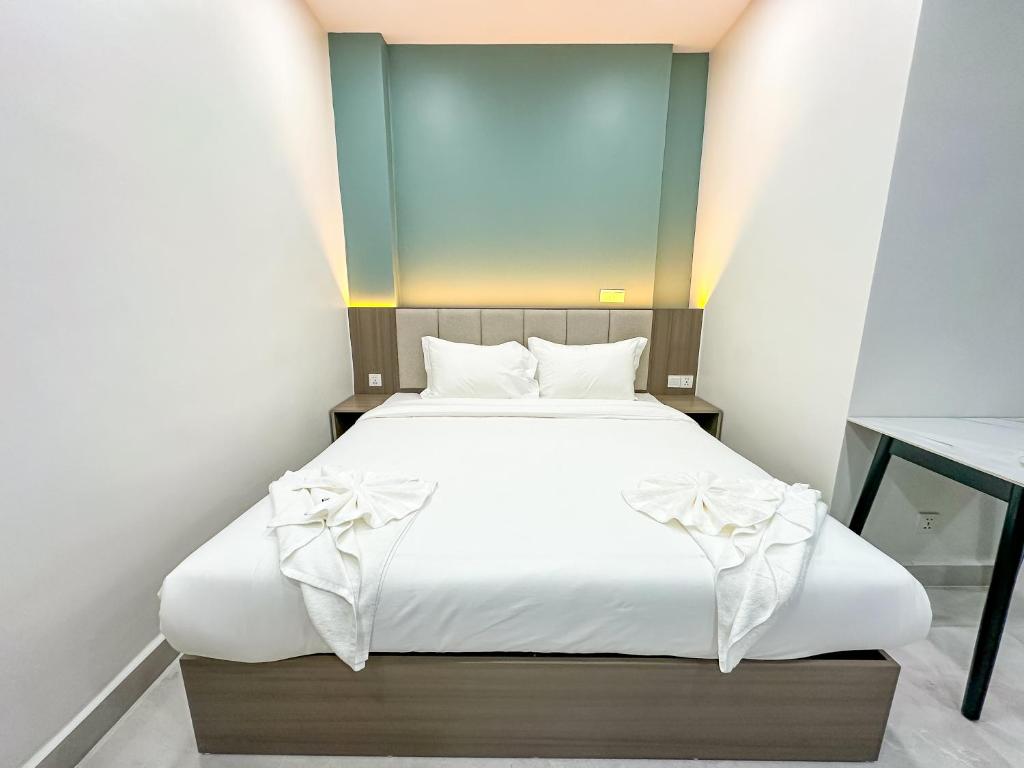 Postel nebo postele na pokoji v ubytování C-Hotel