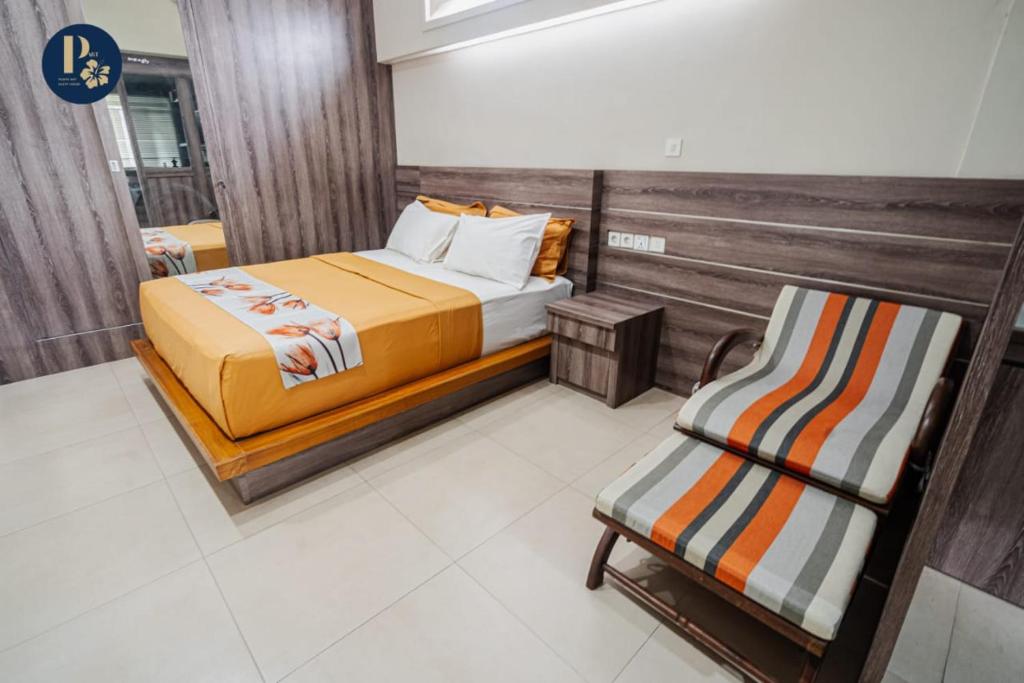 Postel nebo postele na pokoji v ubytování Bali Puspa Guest House