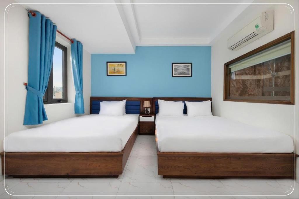 Postel nebo postele na pokoji v ubytování Ngoc Bich hotel