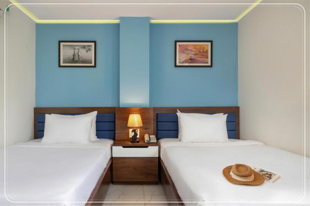 Postel nebo postele na pokoji v ubytování Ngoc Bich hotel