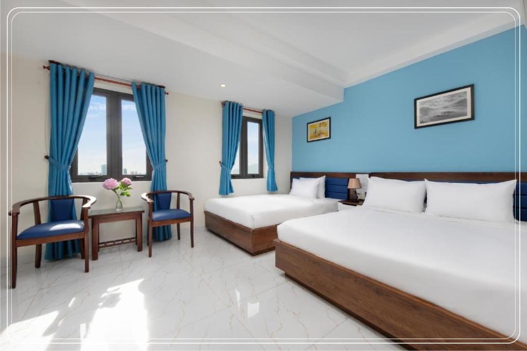 Postel nebo postele na pokoji v ubytování Ngoc Bich hotel