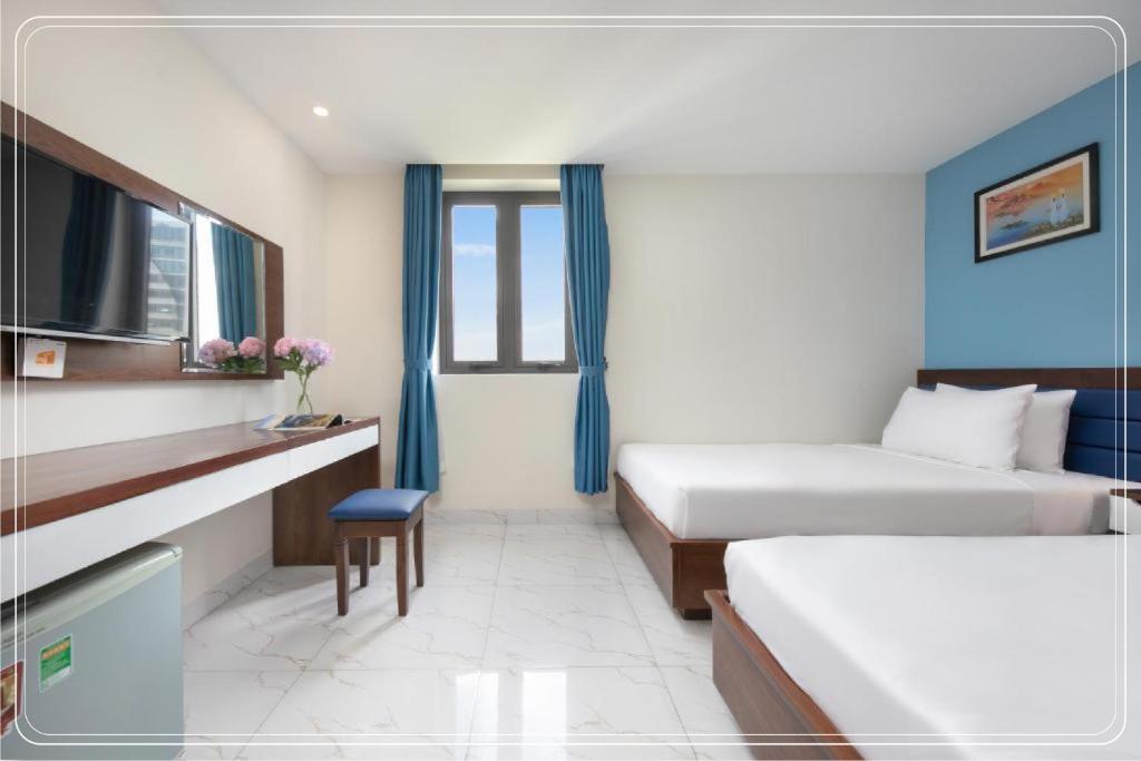 Postel nebo postele na pokoji v ubytování Ngoc Bich hotel