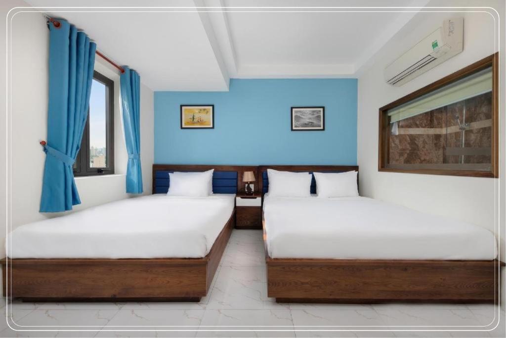 Postel nebo postele na pokoji v ubytování Ngoc Bich hotel