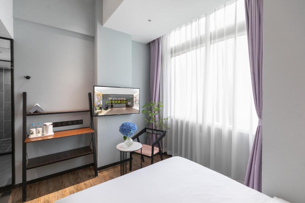 Postel nebo postele na pokoji v ubytování Spring Time Hotel