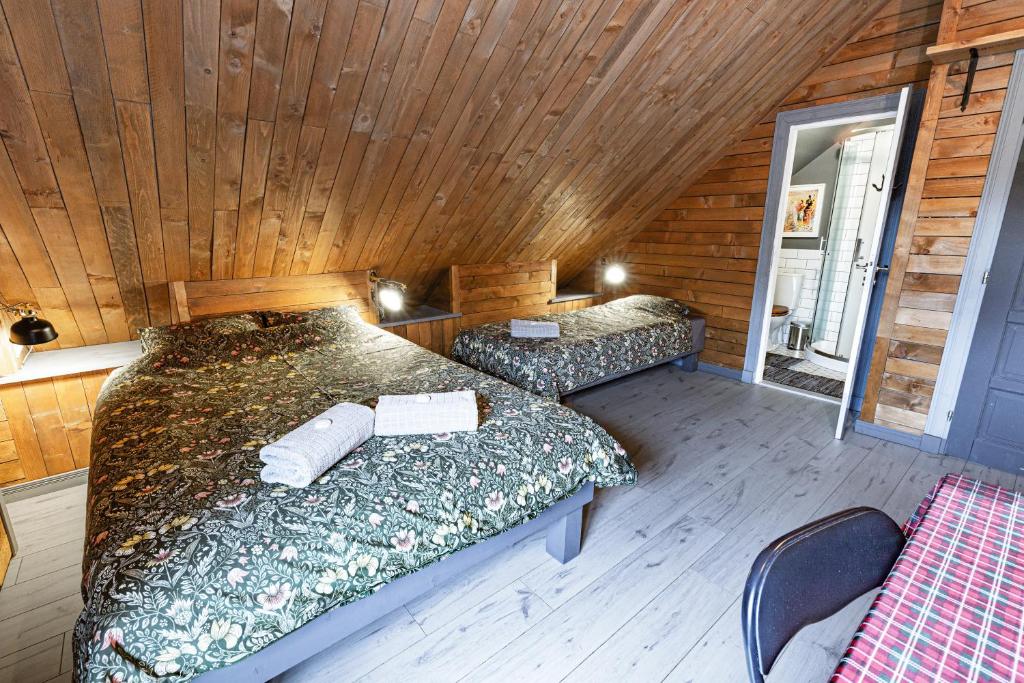 Postel nebo postele na pokoji v ubytování Liptov Lodge