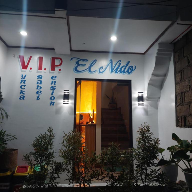 a building with a sign that reads vip el nido at Casa Mariella 888 in El Nido