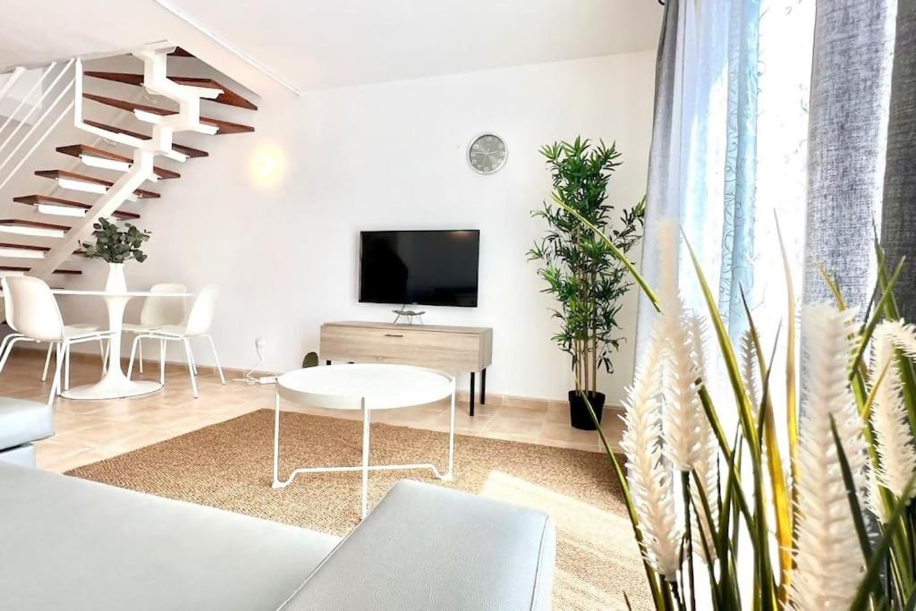 TV a/nebo společenská místnost v ubytování Casa La Macarena