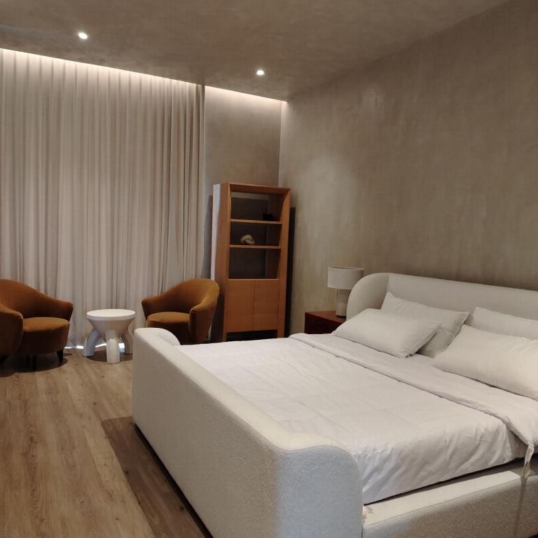Postel nebo postele na pokoji v ubytování Bahay Lian