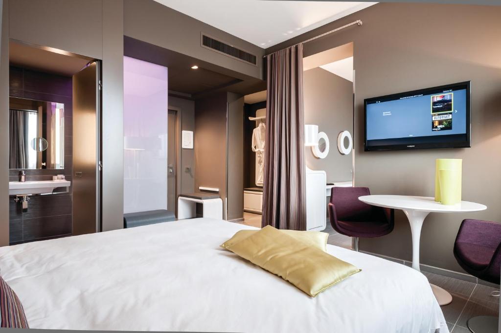 Rúm í herbergi á 8Piuhotel