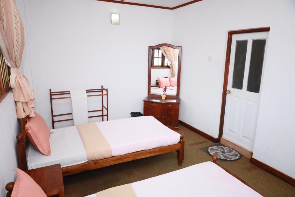 Postel nebo postele na pokoji v ubytování Asiri View Cottage