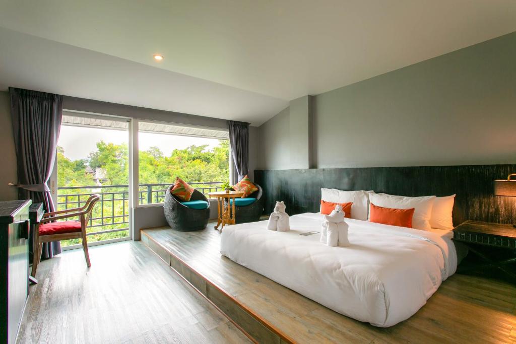 Postel nebo postele na pokoji v ubytování JALMIN Hotel Samui