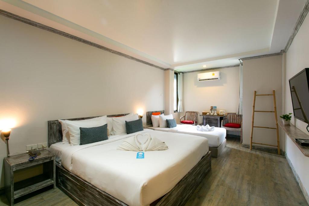 Postel nebo postele na pokoji v ubytování JALMIN Hotel Samui