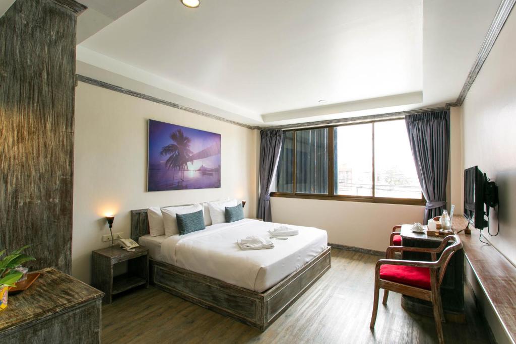 Postel nebo postele na pokoji v ubytování JALMIN Hotel Samui