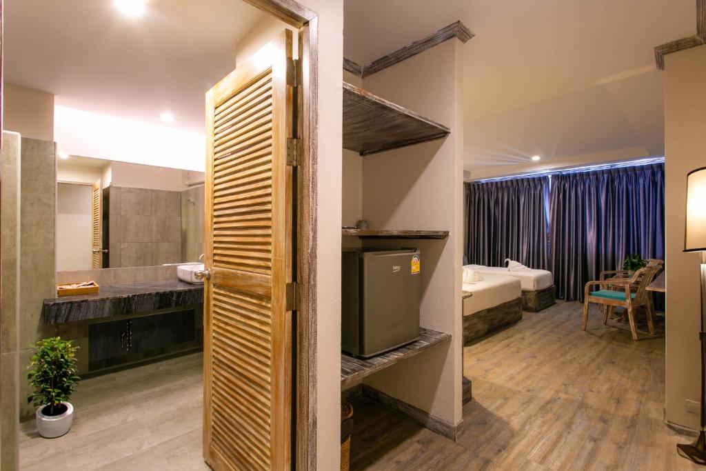 Postel nebo postele na pokoji v ubytování JALMIN Hotel Samui