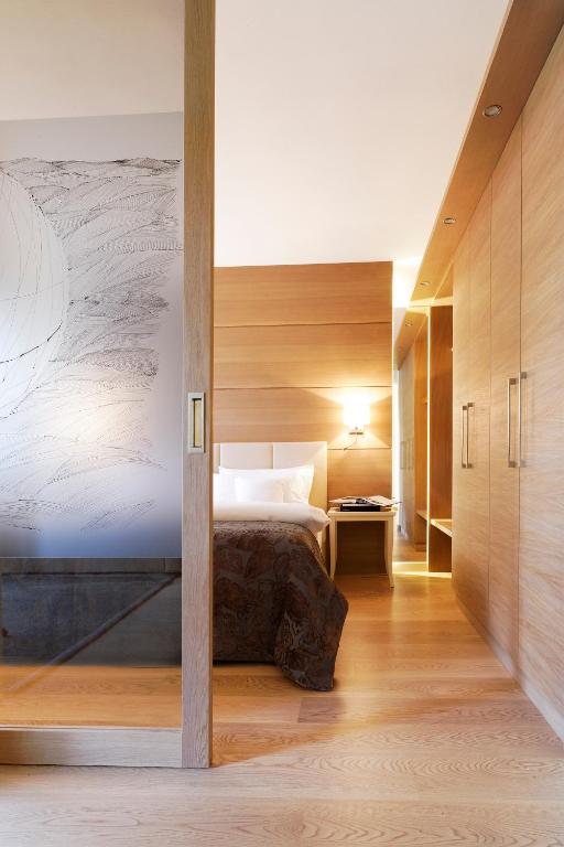 Postel nebo postele na pokoji v ubytování Art & Design Hotel Napura
