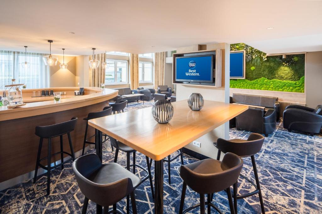 TV a/nebo společenská místnost v ubytování Best Western Hotel München Airport