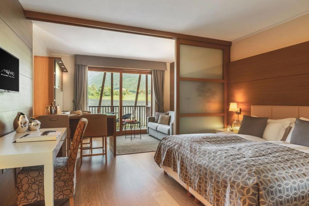 Postel nebo postele na pokoji v ubytování Art & Design Hotel Napura