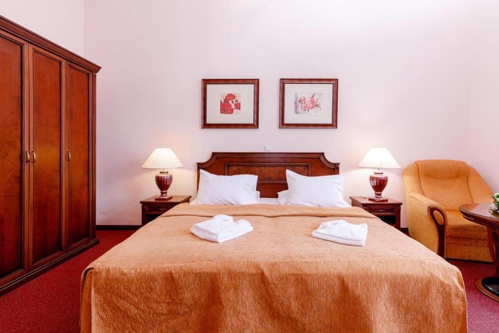 Postel nebo postele na pokoji v ubytování Hotel Ester