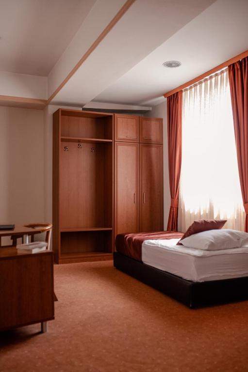 Postel nebo postele na pokoji v ubytování Hotel Drim & SPA