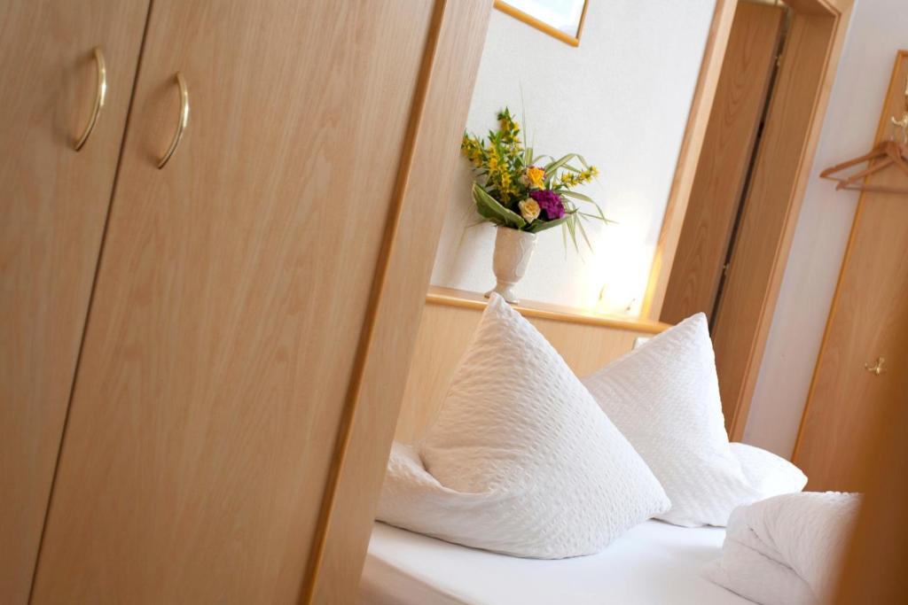 Letto o letti in una camera di Hotel Garni DIAS