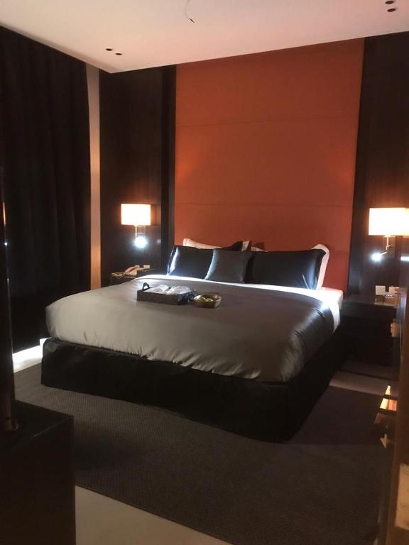 Postel nebo postele na pokoji v ubytování Dana Hotel Residence1