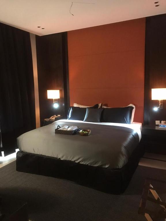 Postel nebo postele na pokoji v ubytování Dana Hotel Residence1