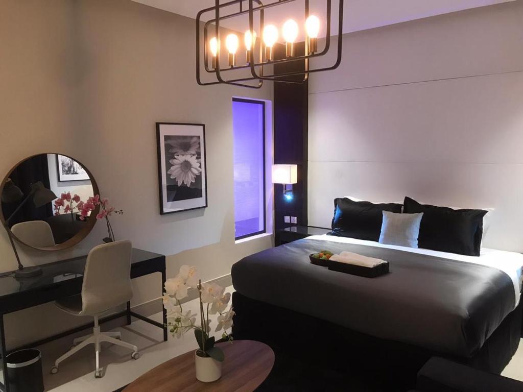 Postel nebo postele na pokoji v ubytování Dana Hotel Residence1