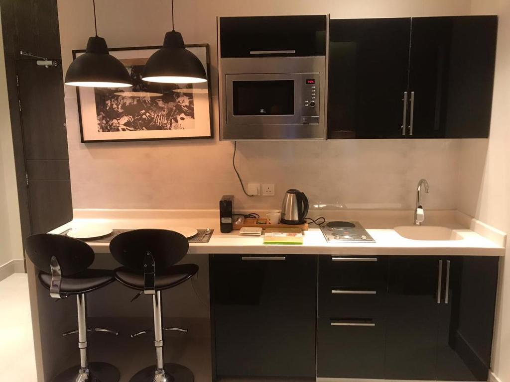 Kuchyň nebo kuchyňský kout v ubytování Dana Hotel Residence1