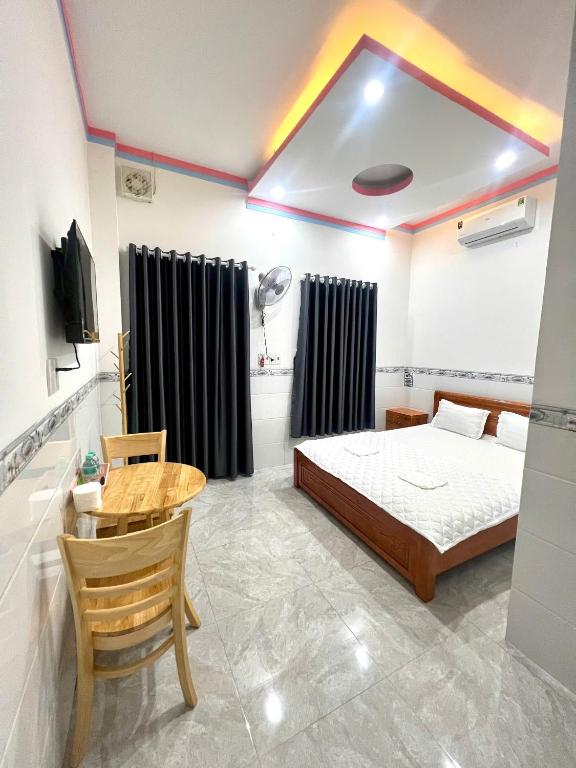 Postel nebo postele na pokoji v ubytování Hotel Ngô Tình
