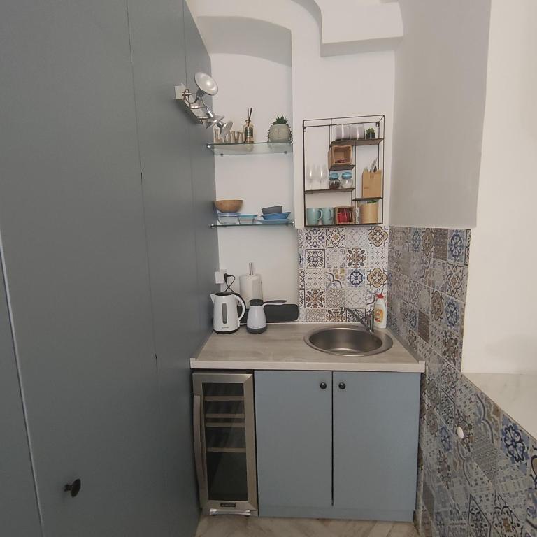 Kuchyň nebo kuchyňský kout v ubytování Room Angel